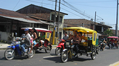 Moto-cars and motorbikes are the main form of travel on the streets of Iquitos. 
