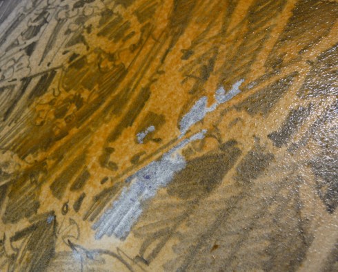 In places the graphite was heavy enough to resist the paint.