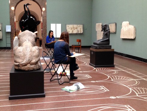 Sketchers draw in the Egyptian Room at Copenhagen's Ny Carlsberg Glyptotek.