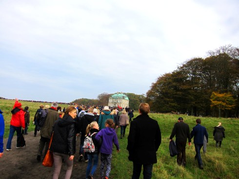 Walking from one jump to the next with the crowd, headed for the next event by the Royal Hunting Castle, the Hermitage on the hill ahead.  